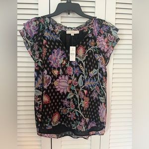 Lightweight printed top with flutter sleeves.